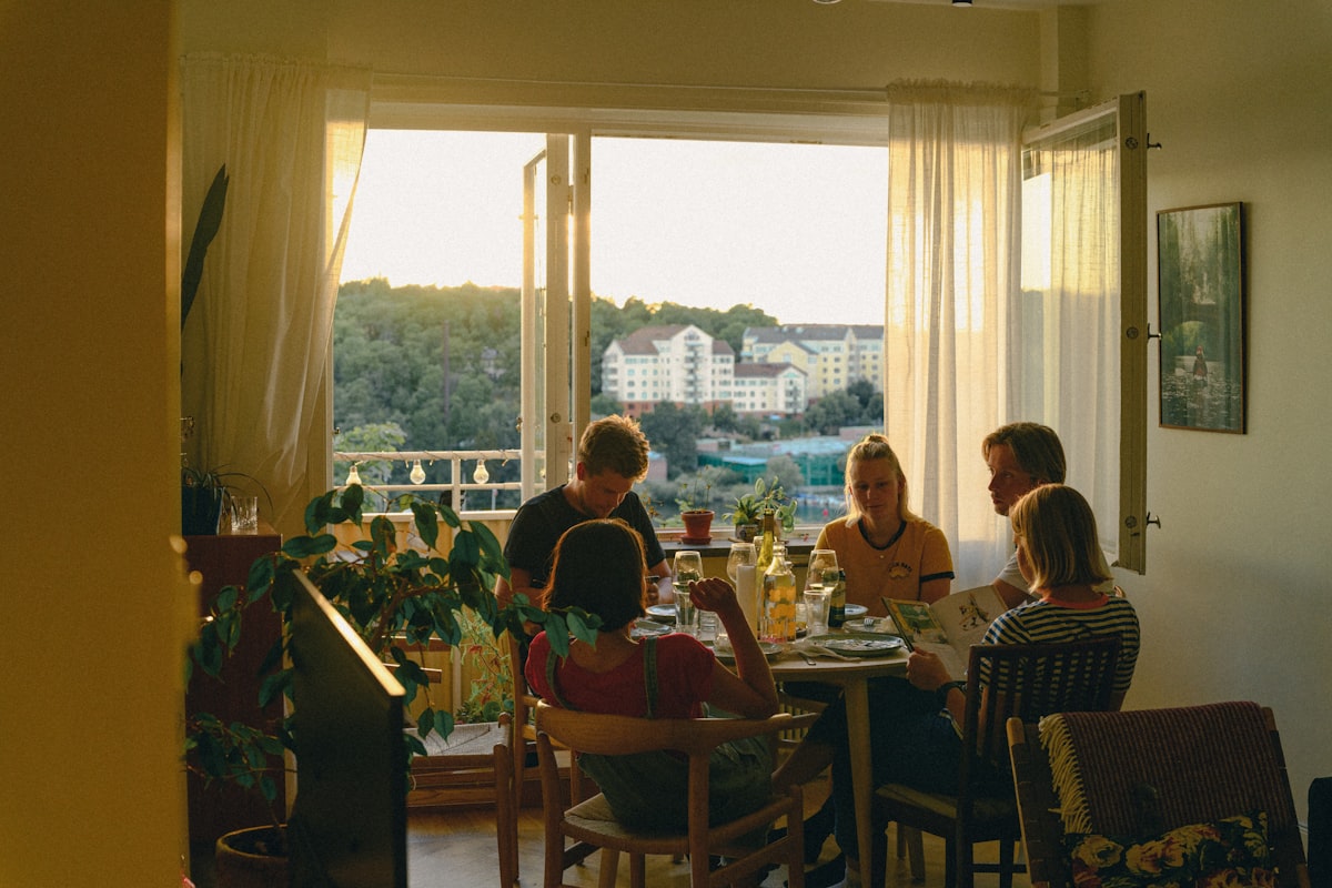 Family cooking together in a bright kitchen